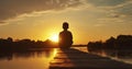 The Silhouette of a Boy Sitting on the Bridge, Immersed in the Beauty of the Sunset Royalty Free Stock Photo