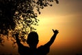 Silhouette of a boy watching at sunset