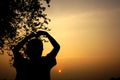 Silhouette of a boy watching at sunset Royalty Free Stock Photo