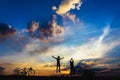 Silhouette boys jumping on sunset.