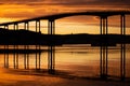 Silhouette of a bridge against an orange sunset sky in Tromso, Norway Royalty Free Stock Photo