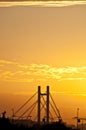 Silhouette of the Bridge against yellow sunset Royalty Free Stock Photo