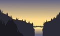 Silhouette of bridge connecting two cliffs Royalty Free Stock Photo