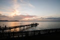 Silhouette Bridge and pavillion on the sea with people walk on t Royalty Free Stock Photo