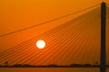 Silhouette of a bridge under setting sun Royalty Free Stock Photo