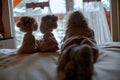 Silhouette of brother and sister siblings looking outside window