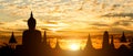 Silhouette of Buddha on golden temple sunset background