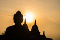 Silhouette of Buddha image and some pagoda. Royalty Free Stock Photo