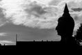 Silhouette Buddha statue with sky background, abstract wallpaper