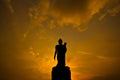 Silhouette Buddha statue in the sunset