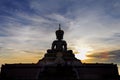 Silhouette buddha statue at Thai temple, sunset in Thailand. Royalty Free Stock Photo