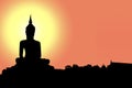 Silhouette of Buddha with sun shining from behind. Royalty Free Stock Photo