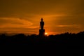 Silhouette Buddha with sunset background