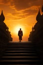 silhouette of buddhist monk walking by temple on mountain at sunset, asian spirituality concept Royalty Free Stock Photo