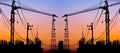 Silhouette of building under construction with crane at sunset Royalty Free Stock Photo