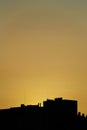 Silhouette of buildings in orange sunset, buildings silhouettes Royalty Free Stock Photo