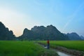 Silhouette of burmese man floating the boat in the water channel