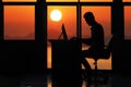 Silhouette business man working on a computer with sunset Royalty Free Stock Photo