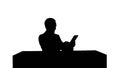 Silhouette Business man working on digital tablet on his table in his office Royalty Free Stock Photo