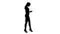 Silhouette Business woman using smartphone and walking. Royalty Free Stock Photo