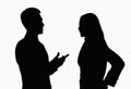 Silhouette of businessman and businesswoman talking. Royalty Free Stock Photo