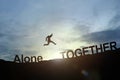 Silhouette of businessman glowing jump alone to together. success concept