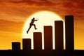 Silhouette of businessman jumping through chart Royalty Free Stock Photo