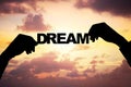 Silhouette businessman's hands holding dream during sunset Royalty Free Stock Photo