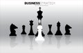 Silhouette of businessman standing on white pawn chess piece in front of all of black chess piece .