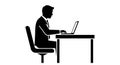 A silhouette of a businessman working on his laptop at a desk in a modern office silhouette Royalty Free Stock Photo