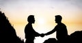 Silhouette businessmen shaking hands during sunset Royalty Free Stock Photo