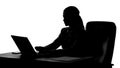 Silhouette of busy woman typing on laptop, secretary working at her job place