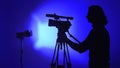 Professional Cameraman Filming on Set with Silhouette Royalty Free Stock Photo
