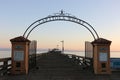 Silhouette of Capitola Wharf at sunset.