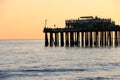 Silhouette of Capitola Wharf at sunset.