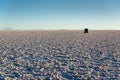 Silhouette of a car in Salar de Uyuni Uyuni salt flats at sunset, Potosi Bolivia