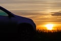 The silhouette of the car at sunset