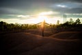 Silhouette of carefree woman expressing freedom with open arms at sunset in the desert at sunset Royalty Free Stock Photo