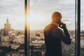 Businessman phoning next to a window Royalty Free Stock Photo