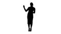 Silhouette Charming smiling energetic woman in formal clothes talking to camera and pointing to the sides.