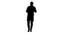 Silhouette Cheerful doctor walking, talking and looking into the