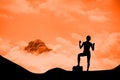 silhouette of cheering person with mountain background Royalty Free Stock Photo