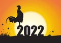 Silhouette of chicken crowing on number 2022 on sunrise background, new year celebration concept Royalty Free Stock Photo