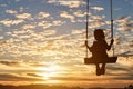 Silhouette of child girl is swing