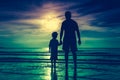 Silhouette of child holding hands her father, standing in the se Royalty Free Stock Photo