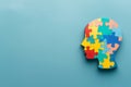 Silhouette of child's head with colorful puzzles on background, autism awareness concept