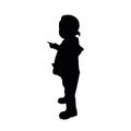 Silhouette child standing in rubber boots.