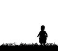 Silhouette of a child walking on grass