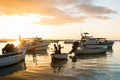 Silhouette of children in a boat at sunset. fish.