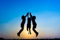 Silhouette of children jumping